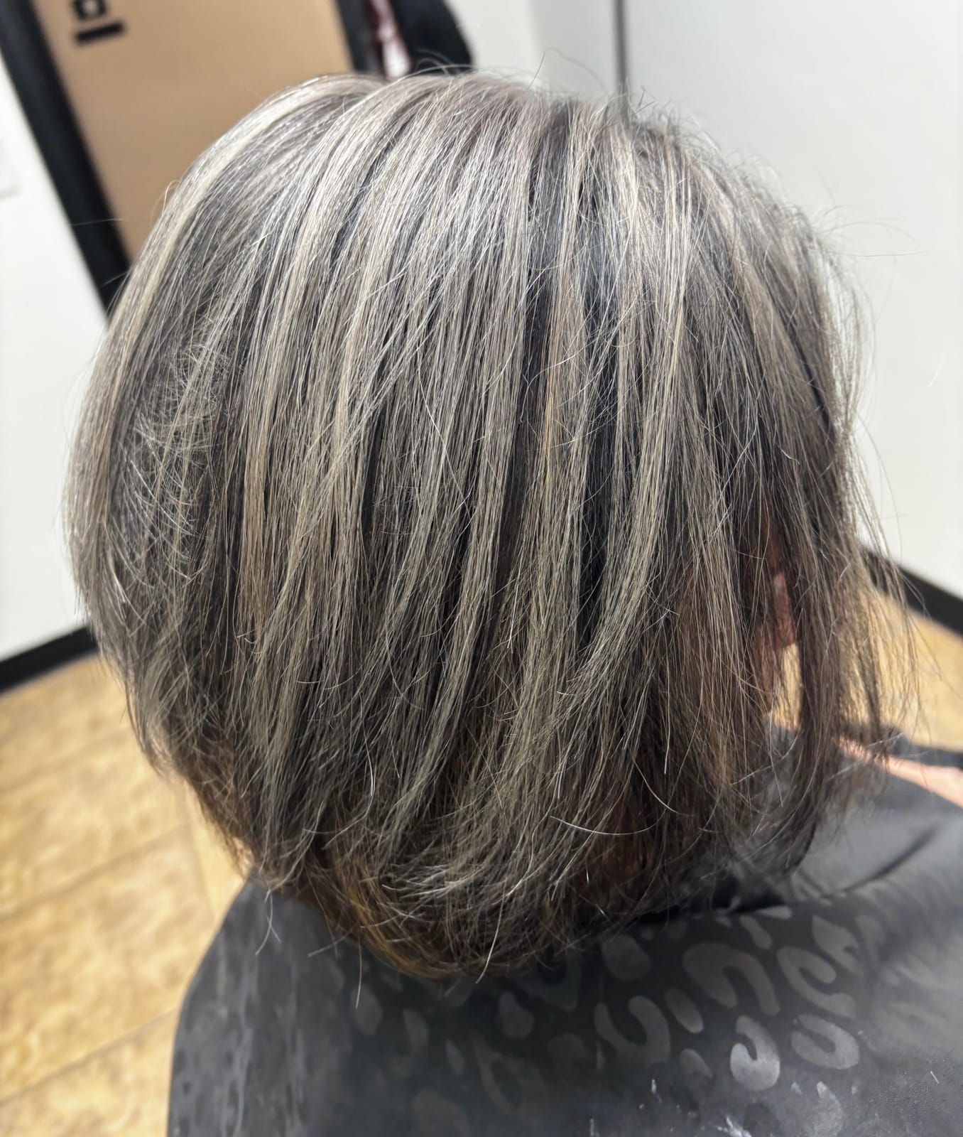 Blended gray coverage and haircut by Styled By Dani