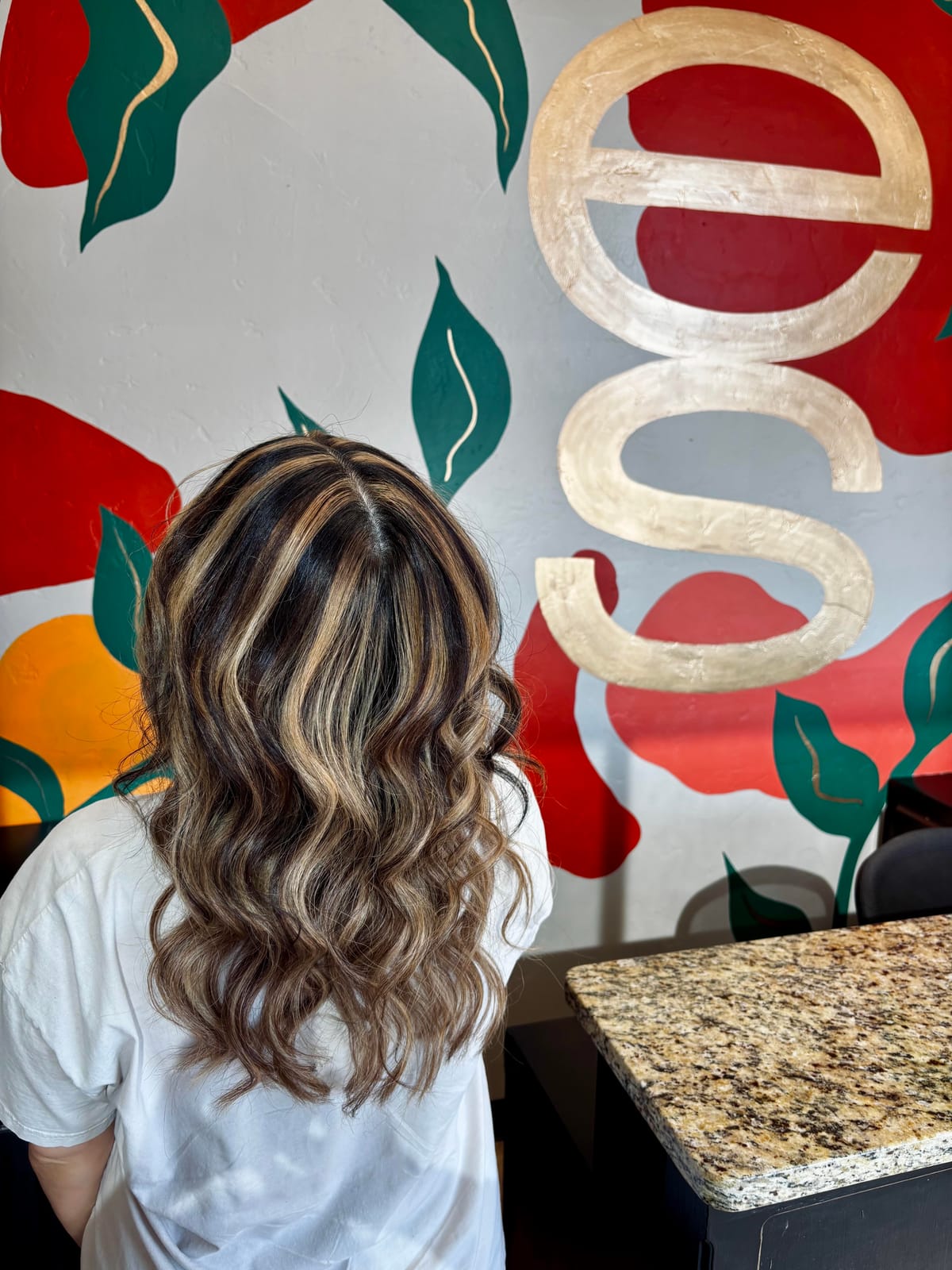 Dark roots with honey blonde highlights and curls by Styled By Dani