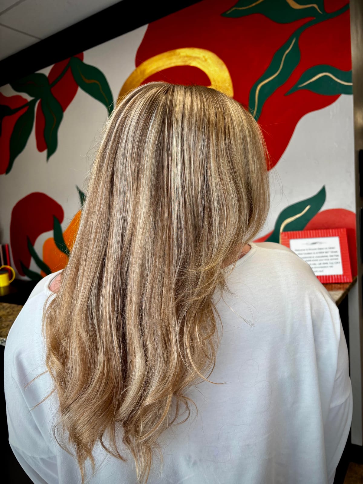 Sleek golden blonde highlights by Styled By Dani